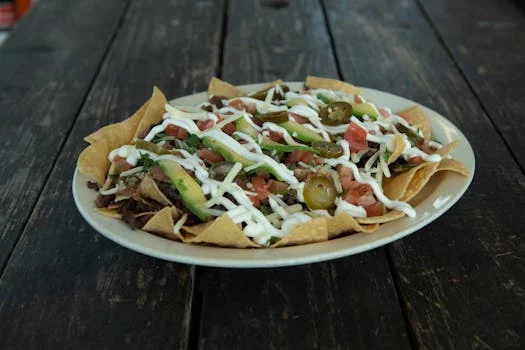 spicy chicken nachos with toppings